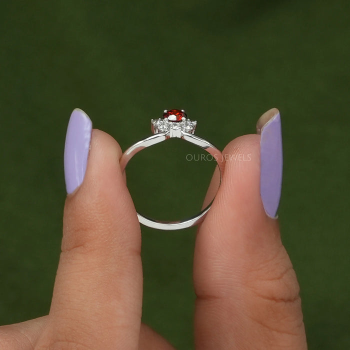 close view of round shape red diamond dainty engagement ring white gold