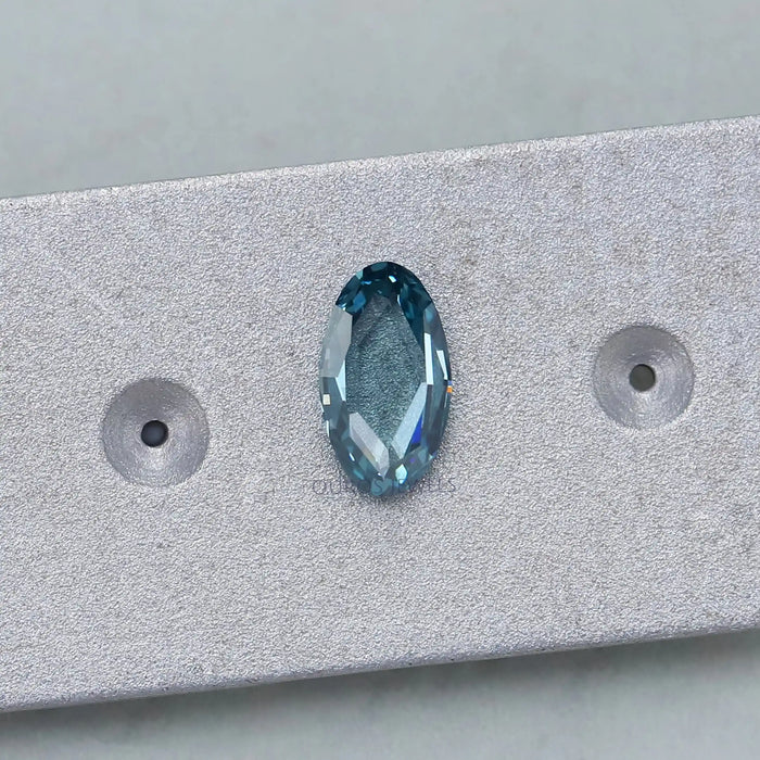 0.53 carat rose cut blue oval cut loose man made diamond on matte material