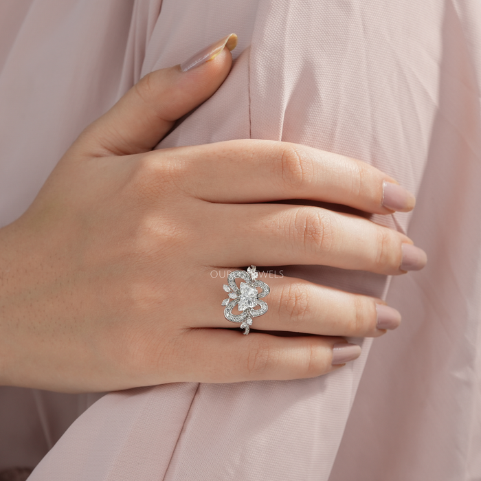 unique butterfly-cut lab-grown diamond cluster engagement ring on model's finger