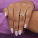 In finger look of yellow pear shaped lab created diamond ring with round accent stones