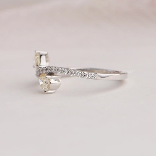Round Accent Stones Studded On 14k White Gold Curved Shank Of Pear Shaped Yellow Diamond Ring